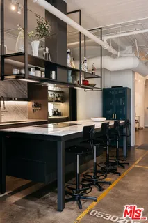 a kitchen with a table and chairs in it