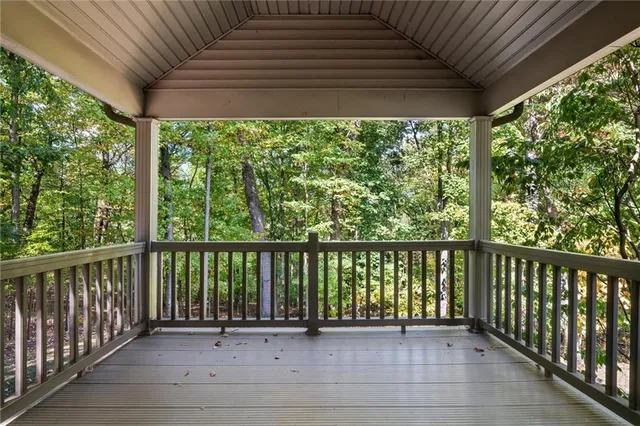 a view of a porch with wooden floor and outdoor space