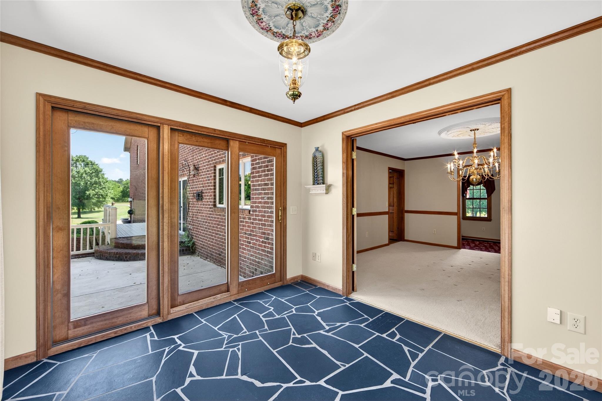 40659 Ridenhour Road Richfield, NC 28137 - Photo 11 of 25 a view of a hallway with a glass door and porch