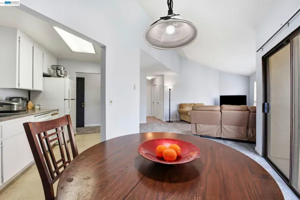 a view of a dining room with furniture window and outside view