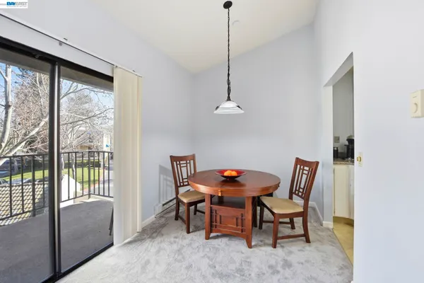 a view of a dining room with furniture window and outside view