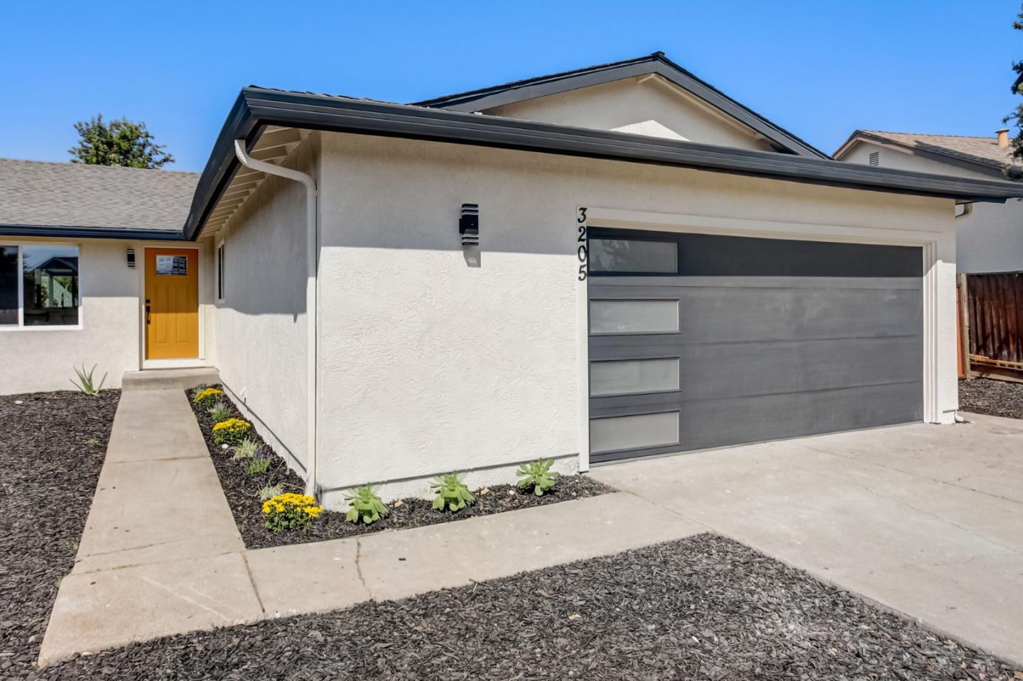 3205 Napa Court San Jose, CA 95148 - Photo 1 of 18 a front view of a house with garage