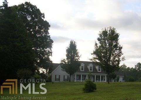 1976 Floyd Springs Road Northeast Armuchee, GA 30105 - Photo 1 of 1 a front view of a house with garden