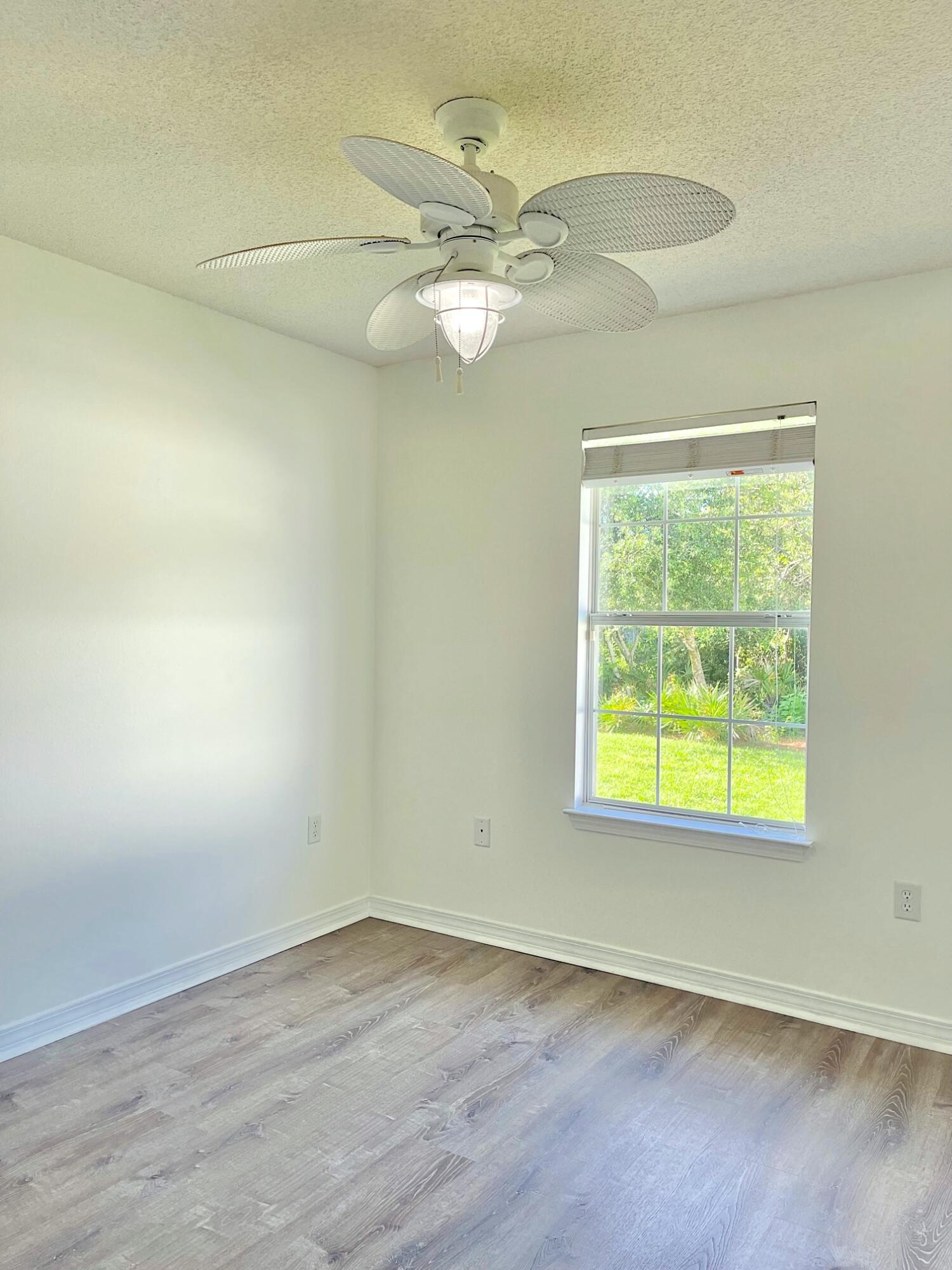 440 Sandy Cay Drive Miramar Beach, FL 32550 - Photo 17 of 48 an empty room with a window and a fan