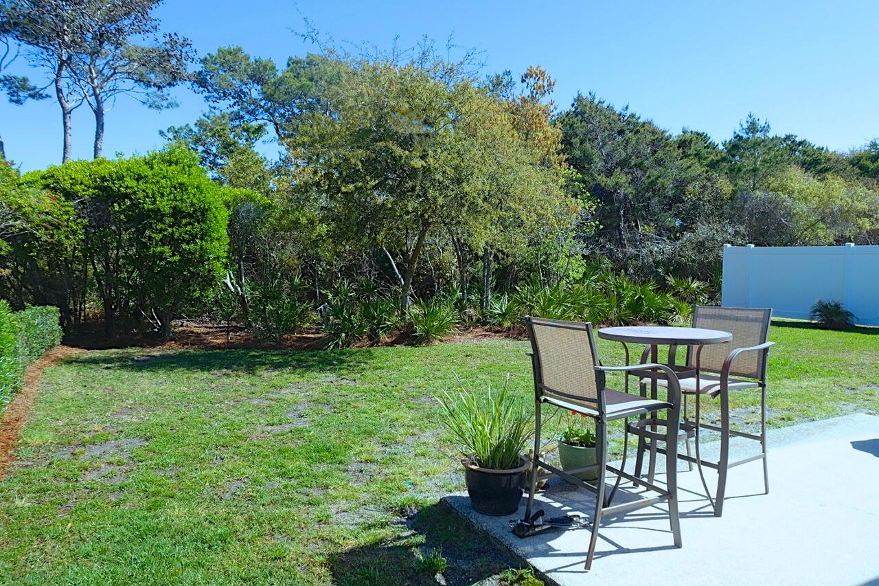 440 Sandy Cay Drive Miramar Beach, FL 32550 - Photo 44 of 48 a view of a chairs and table in the garden