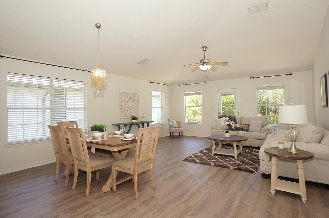 440 Sandy Cay Drive Miramar Beach, FL 32550 - Photo 6 of 48 a view of a dining room with furniture window and wooden floor
