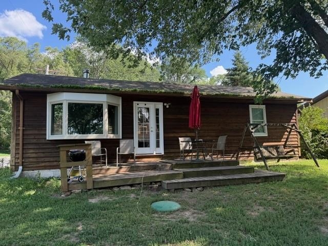 102 North Main Street Byron, IL 61010 - Photo 2 of 16 a view of a house with backyard porch and sitting area