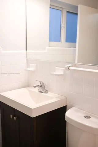a bathroom with a sink and a toilet