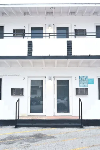 a kitchen with a sink stainless steel appliances and cabinets