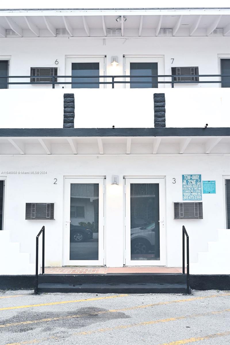 345 85th Street Miami Beach, FL 33141 - Photo 20 of 26 a kitchen with a sink stainless steel appliances and cabinets