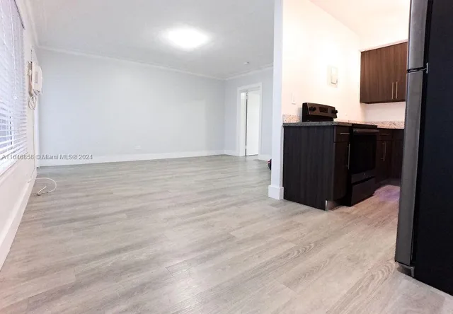 a view of kitchen with wooden floor