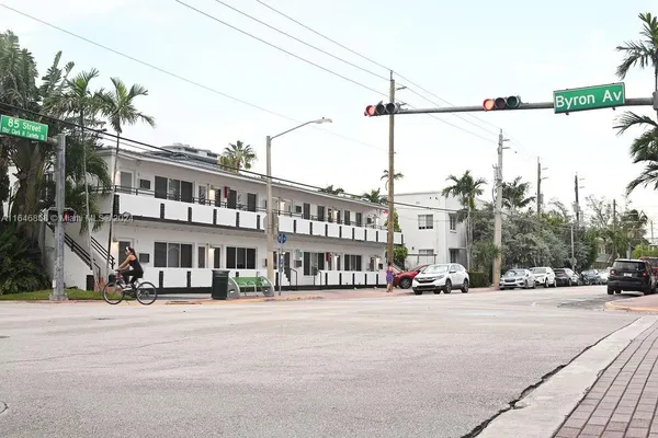 a view of a street with cars