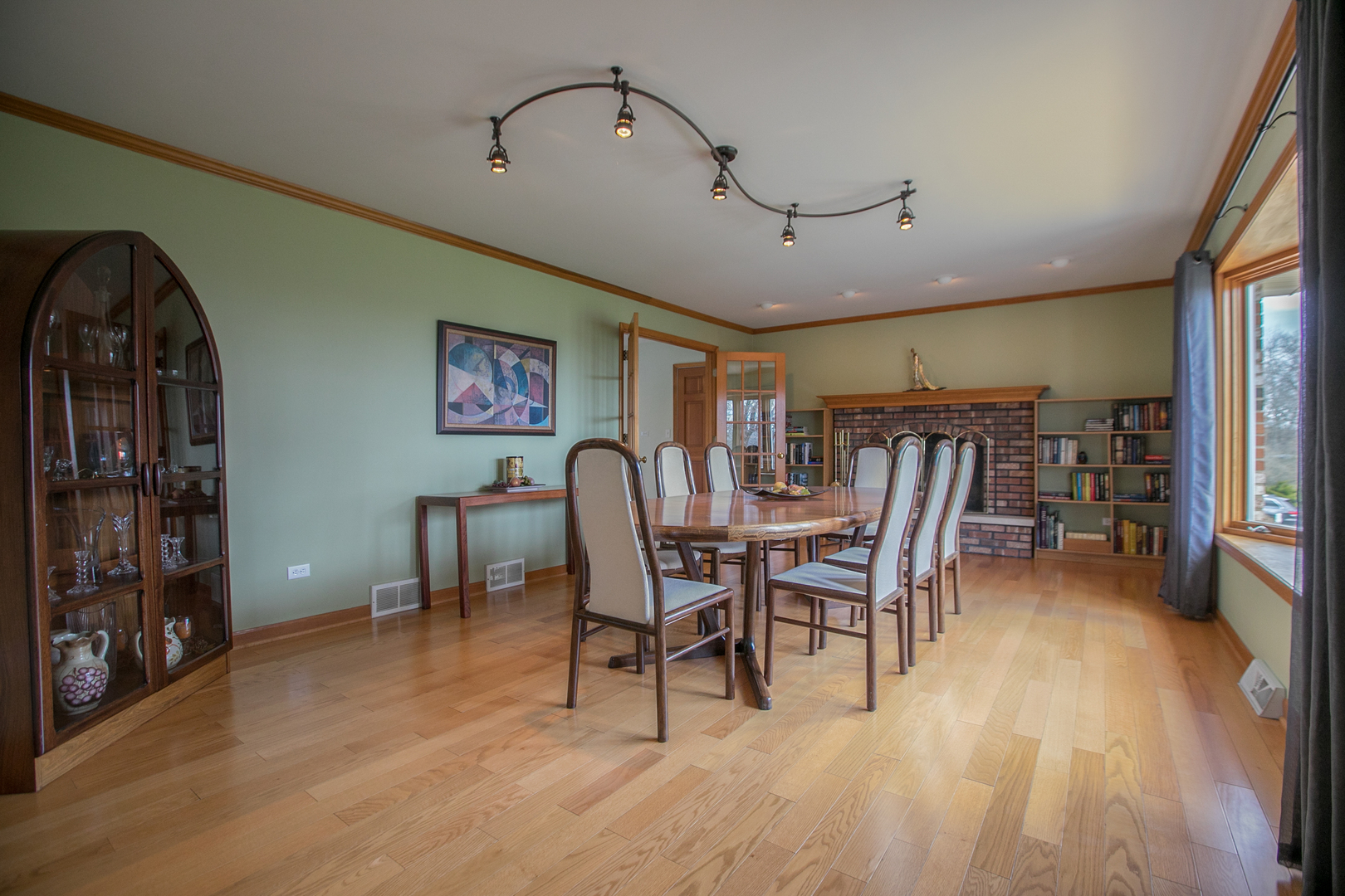 16N560 Sumter Drive Dundee, IL 60118 - Photo 14 of 49 a dining room with furniture and wooden floor