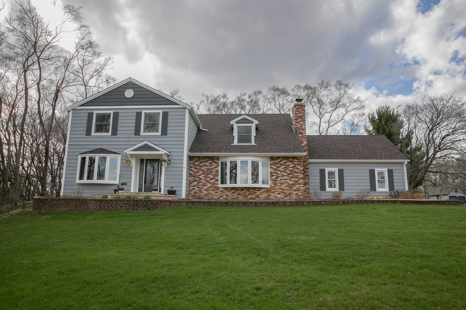 16N560 Sumter Drive Dundee, IL 60118 - Photo 2 of 49 a front view of house with yard and green space