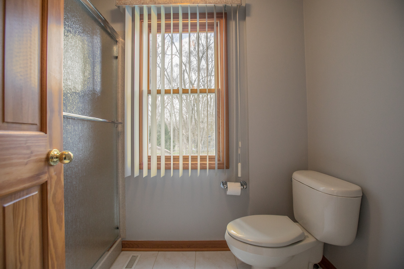 16N560 Sumter Drive Dundee, IL 60118 - Photo 30 of 49 a white toilet sitting in front of a window