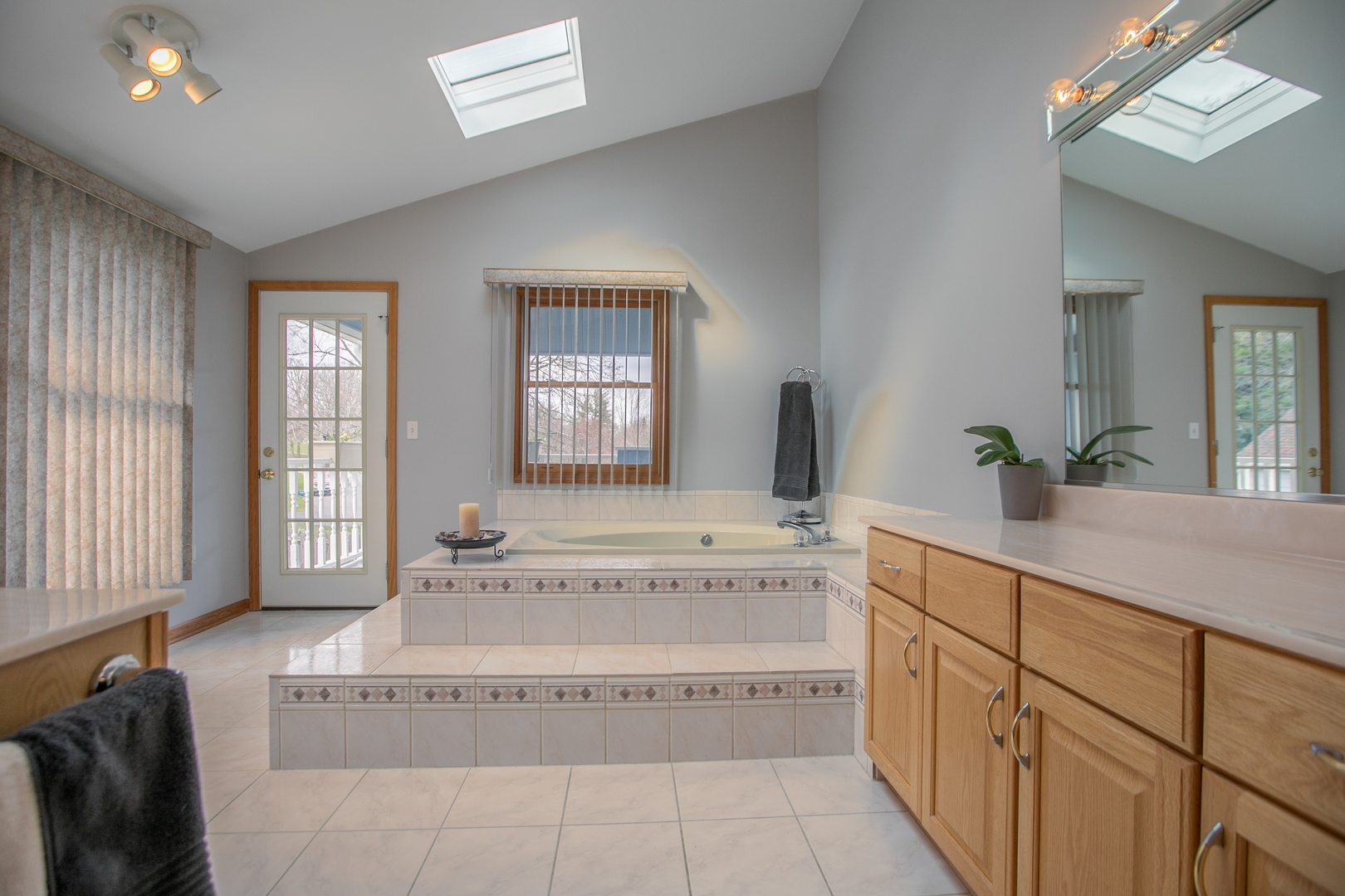 16N560 Sumter Drive Dundee, IL 60118 - Photo 31 of 49 a spacious bathroom with a tub double sink and mirror