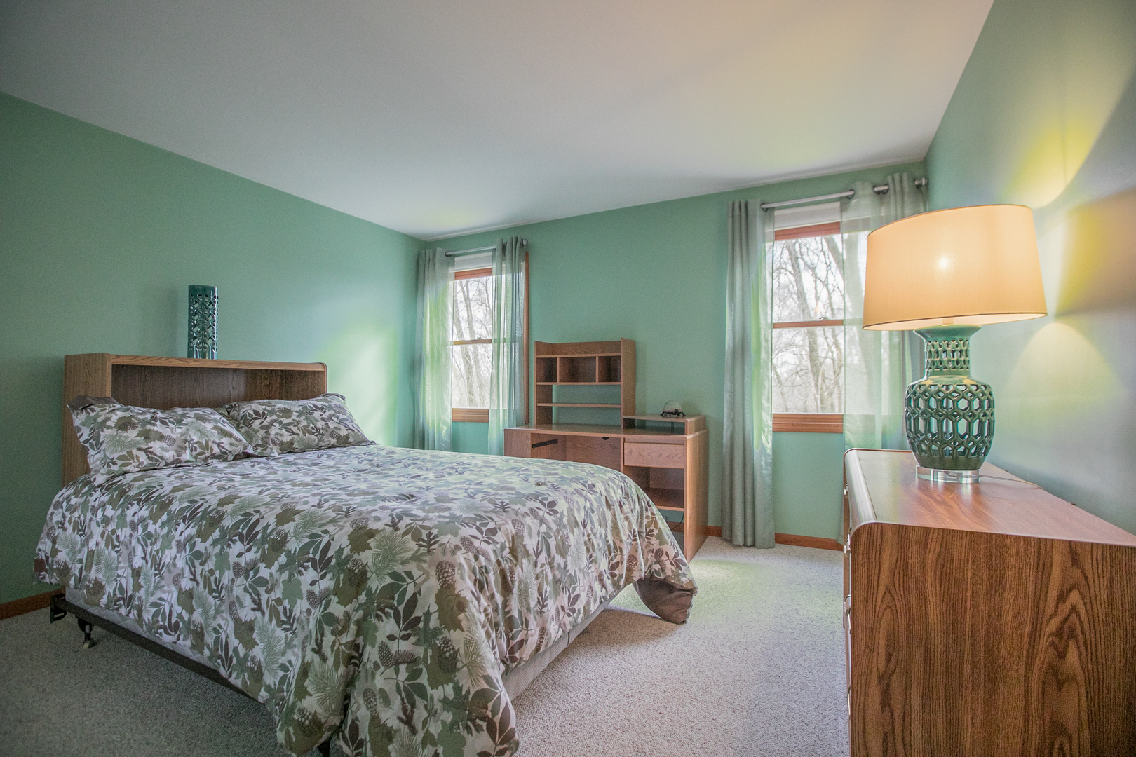16N560 Sumter Drive Dundee, IL 60118 - Photo 35 of 49 a bedroom with a bed and a lamp