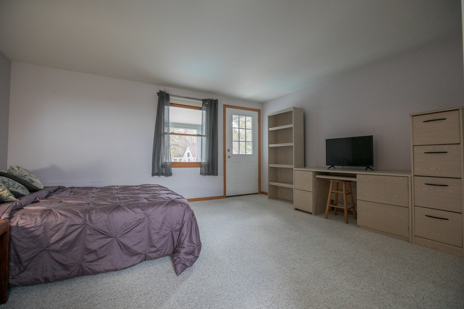 16N560 Sumter Drive Dundee, IL 60118 - Photo 38 of 49 a spacious bedroom with a bed and a flat screen tv