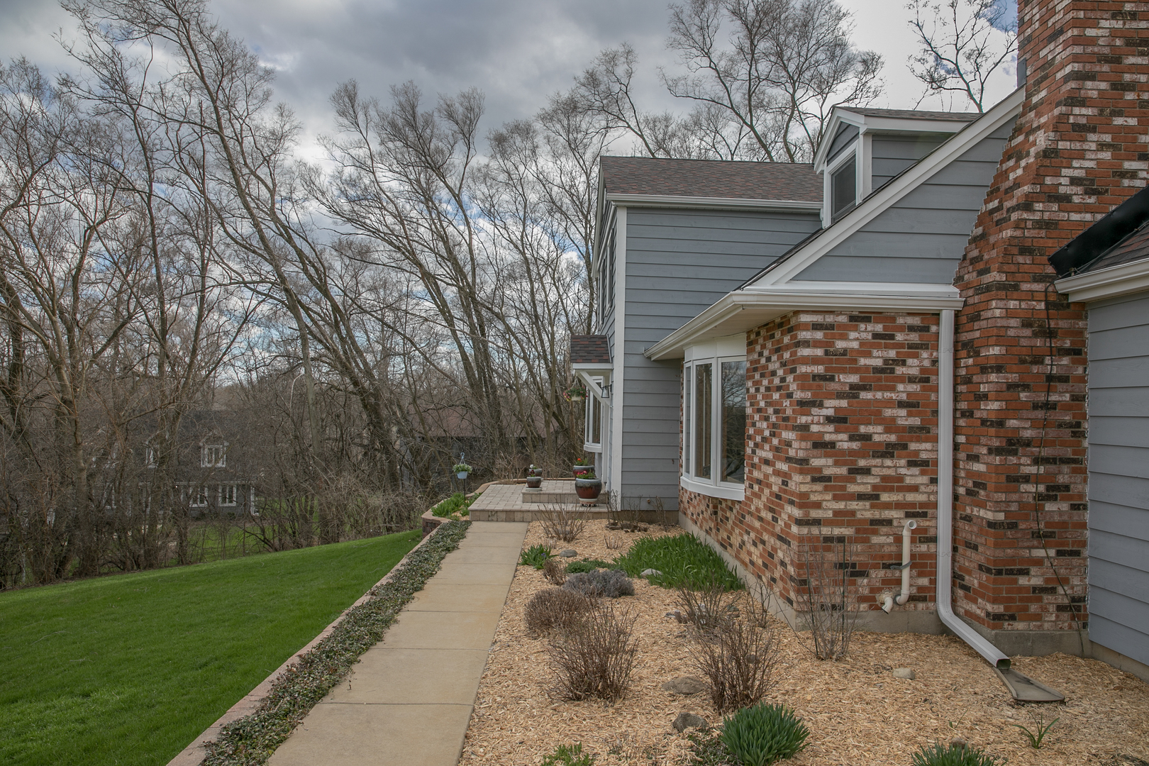 16N560 Sumter Drive Dundee, IL 60118 - Photo 10 of 49 a front view of a house with a garden