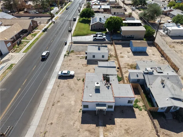 an aerial view of a house with outdoor space
