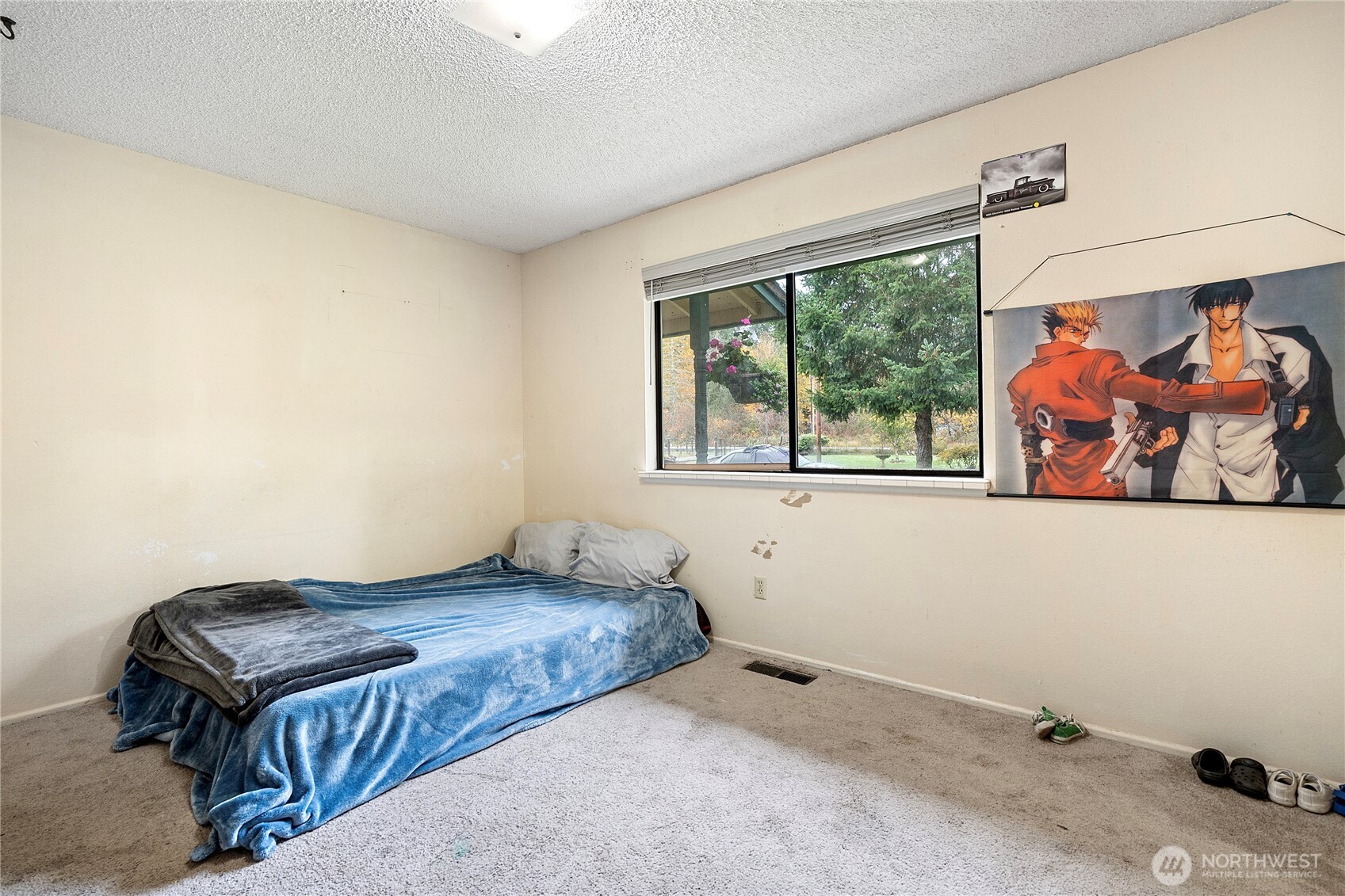 26707 Orville Road East Orting, WA 98360 - Photo 11 of 36 a bedroom with a bed and wooden floor