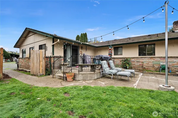 a view of a backyard with a patio