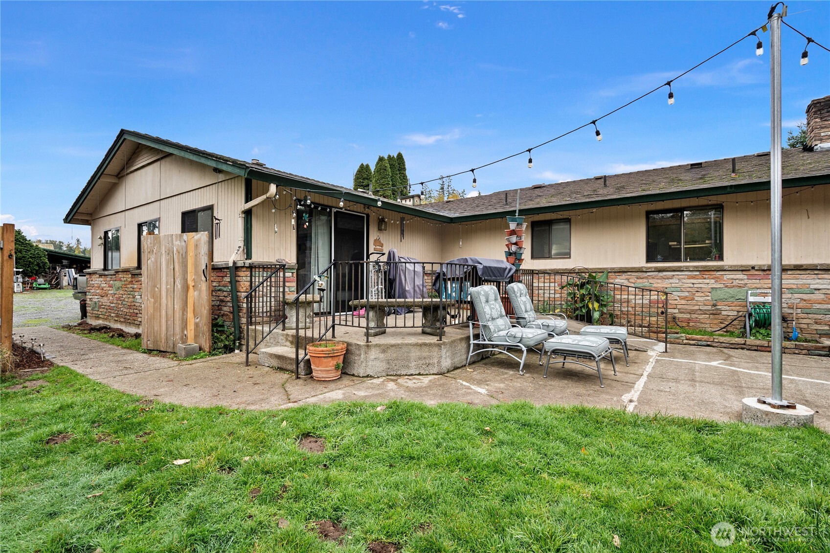 26707 Orville Road East Orting, WA 98360 - Photo 22 of 36 a view of a backyard with a patio