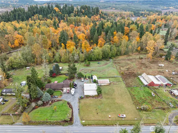 an aerial view of a house with a yard