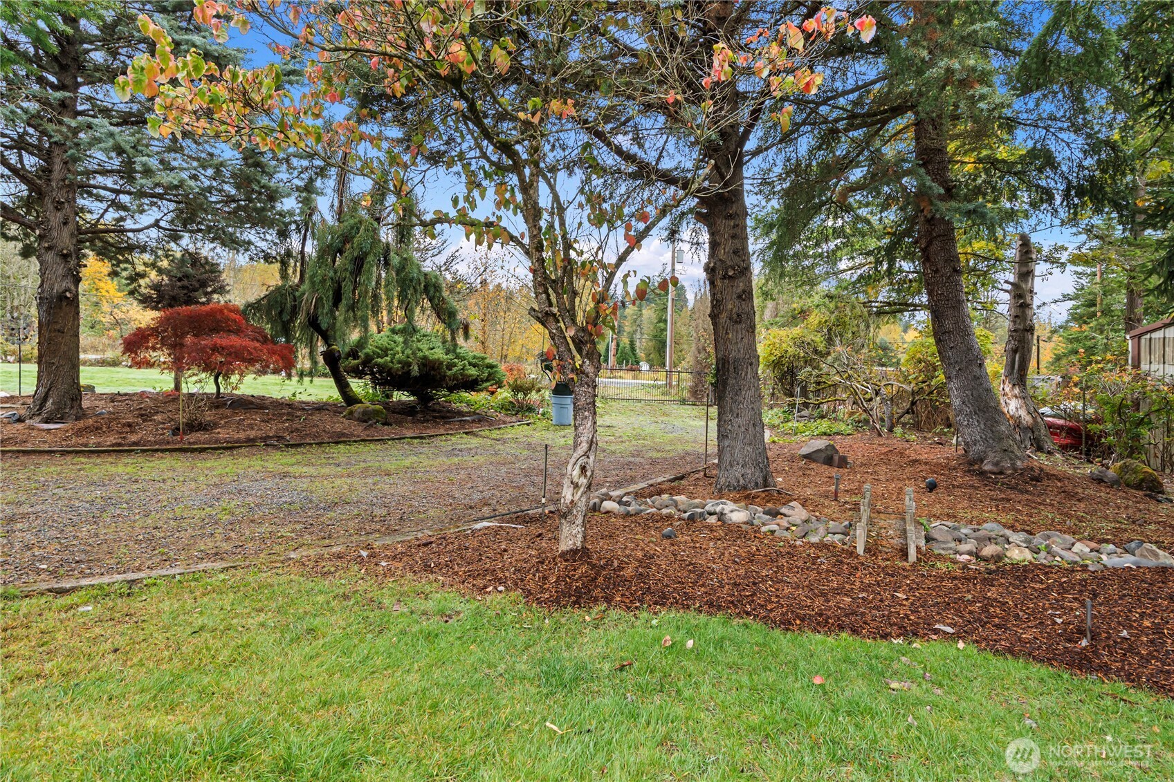 26707 Orville Road East Orting, WA 98360 - Photo 33 of 36 a backyard of a house with lots of green space