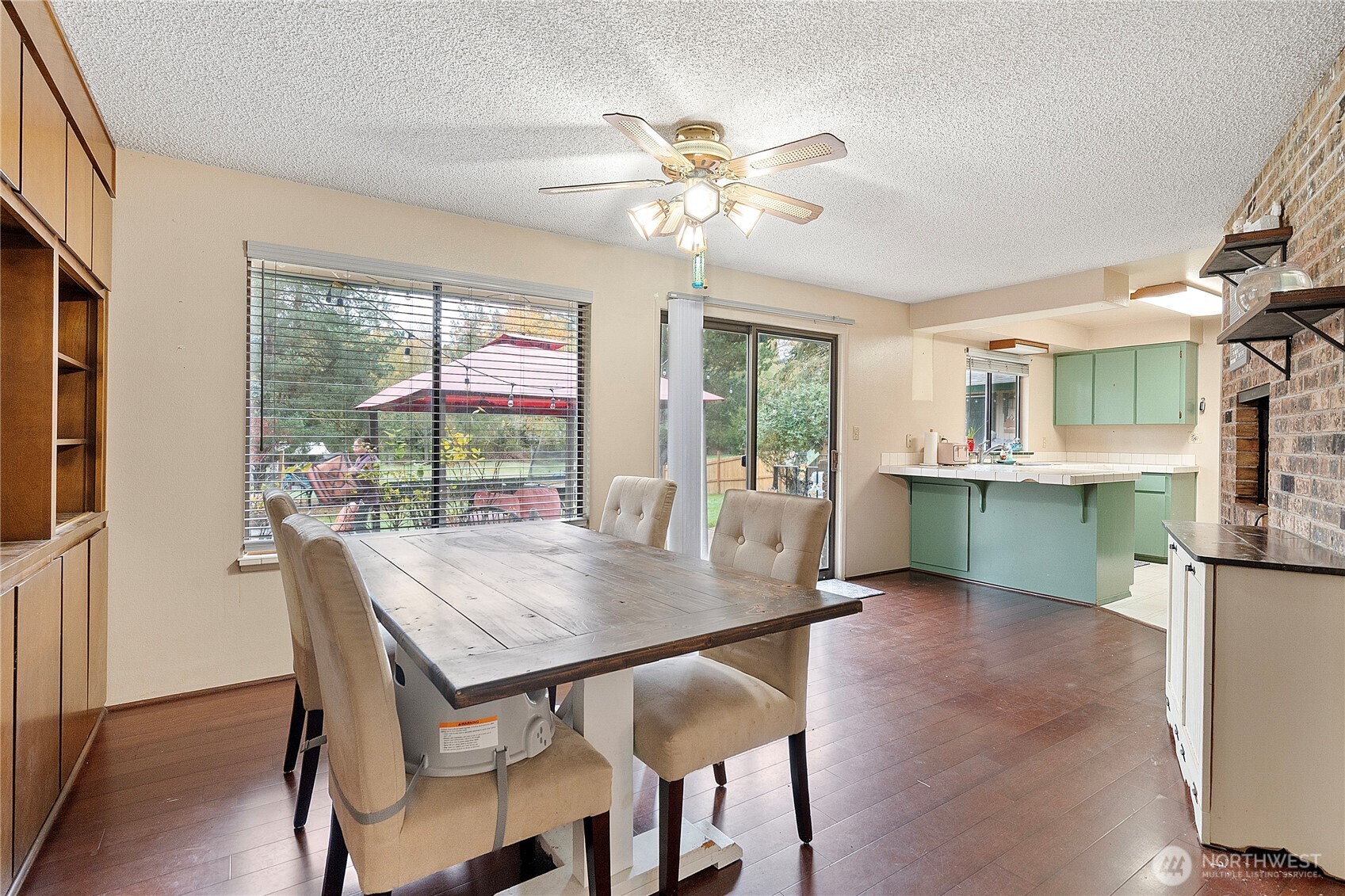 26707 Orville Road East Orting, WA 98360 - Photo 5 of 36 a view of a dining room with furniture window and wooden floor
