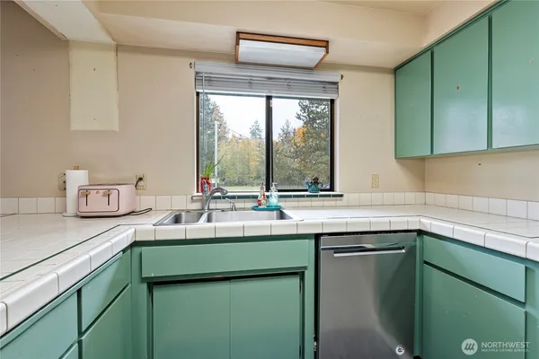 a kitchen with a sink and a window
