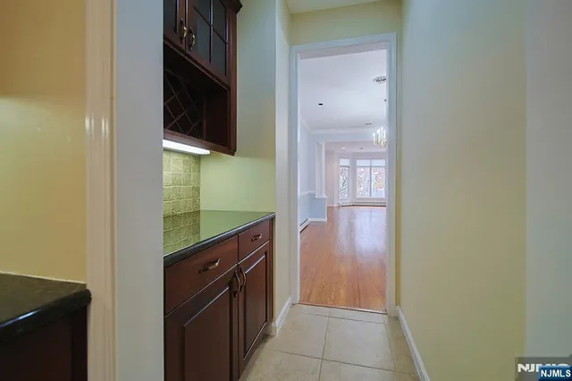 a kitchen with a refrigerator and a sink