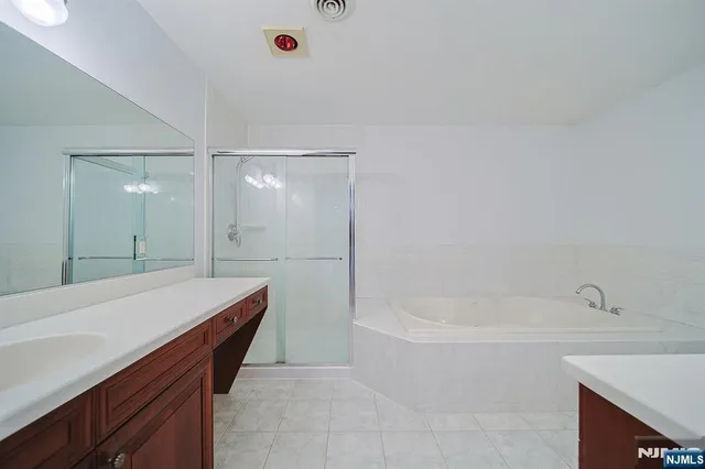 a bathroom with a bathtub and a sink