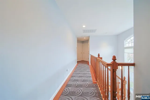 a view of a hallway with stairs