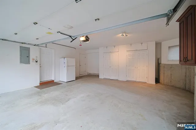 a view of empty room with wooden ceiling