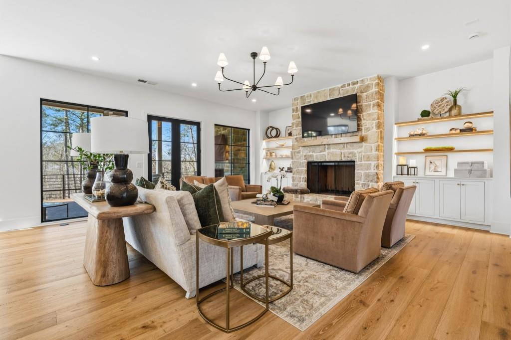 287 Mountain View Ridge Northwest Marietta, GA 30064 - Photo 17 of 77 a living room with fireplace furniture and a wooden floor