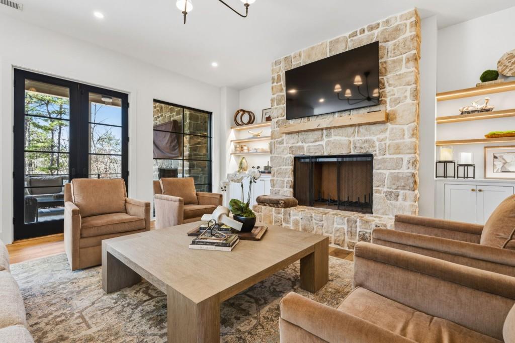 287 Mountain View Ridge Northwest Marietta, GA 30064 - Photo 18 of 77 a living room with furniture a flat screen tv and a fireplace