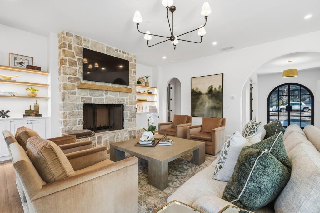 287 Mountain View Ridge Northwest Marietta, GA 30064 - Photo 22 of 77 a living room with furniture a flat screen tv and a fireplace