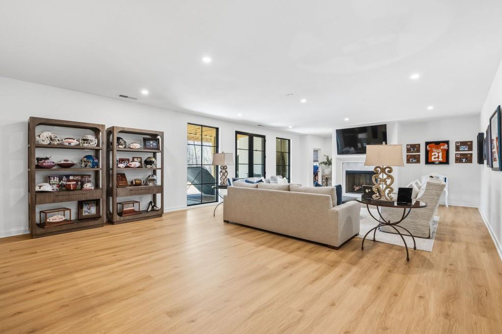 287 Mountain View Ridge Northwest Marietta, GA 30064 - Photo 64 of 77 a living room with furniture and a wooden floor