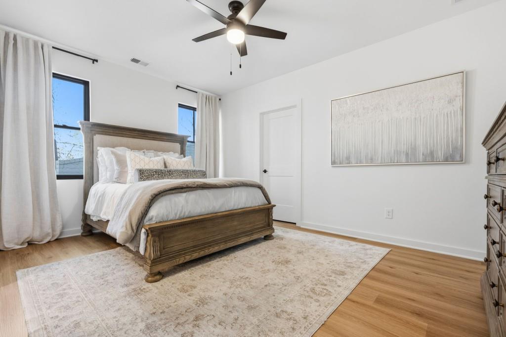 287 Mountain View Ridge Northwest Marietta, GA 30064 - Photo 70 of 77 a bedroom with a bed and a chandelier