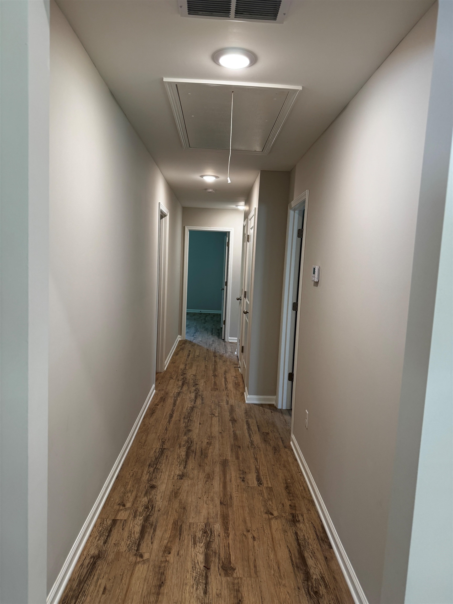 5283 Zodiac Road Memphis, TN 38118 - Photo 4 of 13 Hallway featuring wood-finish flooring and recessed lighting