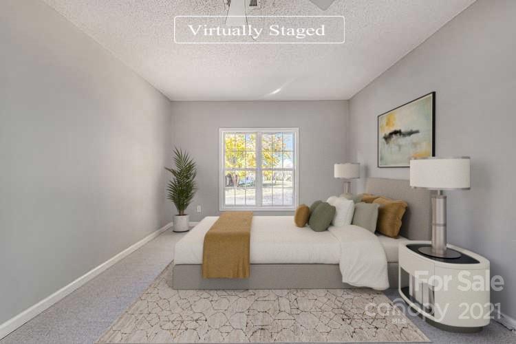 3021 Winners Circle Southwest Concord, NC 28025 - Photo 11 of 20 a bedroom with bed and a window