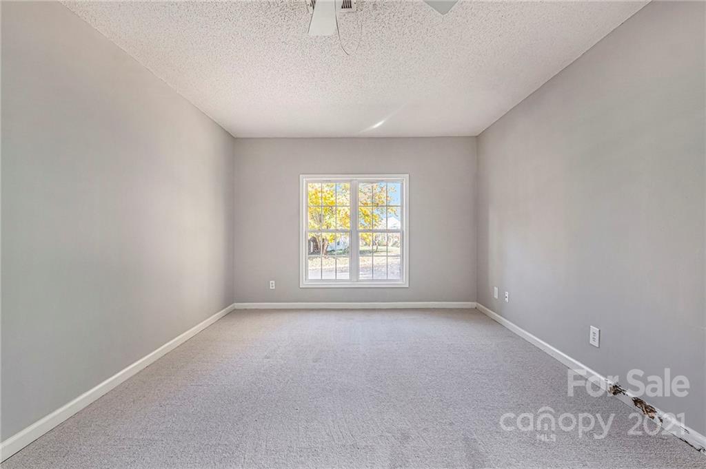 3021 Winners Circle Southwest Concord, NC 28025 - Photo 12 of 20 a view of a livingroom with a window