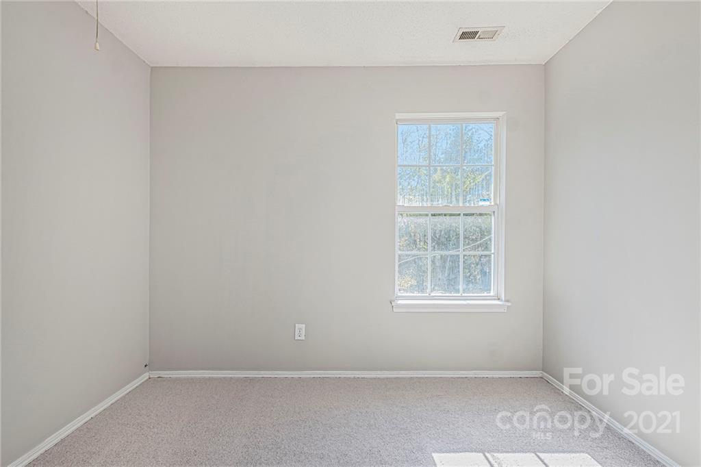 3021 Winners Circle Southwest Concord, NC 28025 - Photo 13 of 20 an empty room with a window