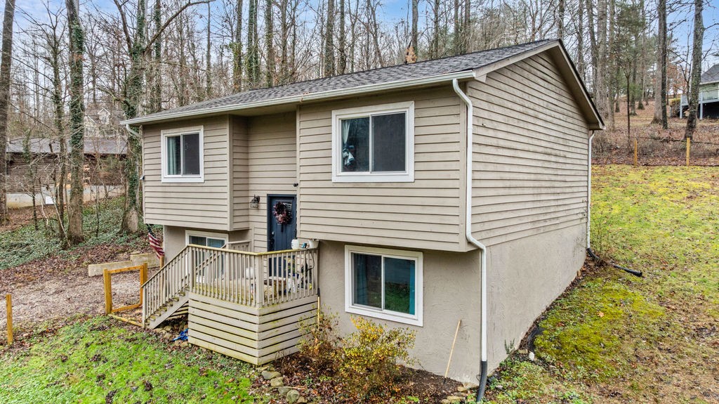 250 McDeerman Road Jacksboro, TN 37757 - Photo 21 of 25 a front view of a house with a garden