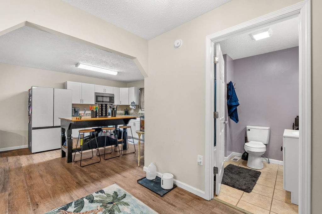 250 McDeerman Road Jacksboro, TN 37757 - Photo 8 of 25 a work room with furniture and a wooden floor