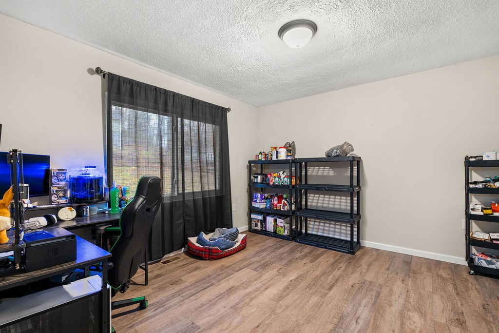 250 McDeerman Road Jacksboro, TN 37757 - Photo 9 of 25 a room with furniture and a wooden floor