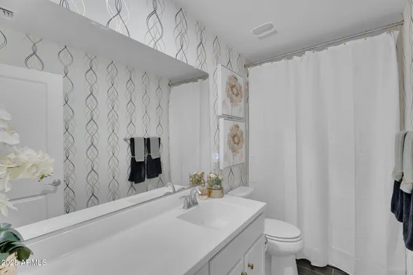 a workspace with furniture and mirror