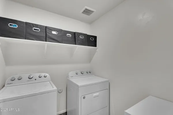 a view of a hallway with paintings on the wall