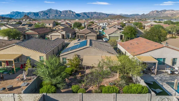 an aerial view of residential houses with outdoor space